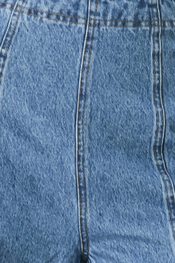 A washed denim pant with elastic waist and wide leg. 