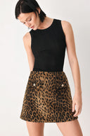 A model wearing a brown leopard-print mini skirt with two front button details | FREEMARKET