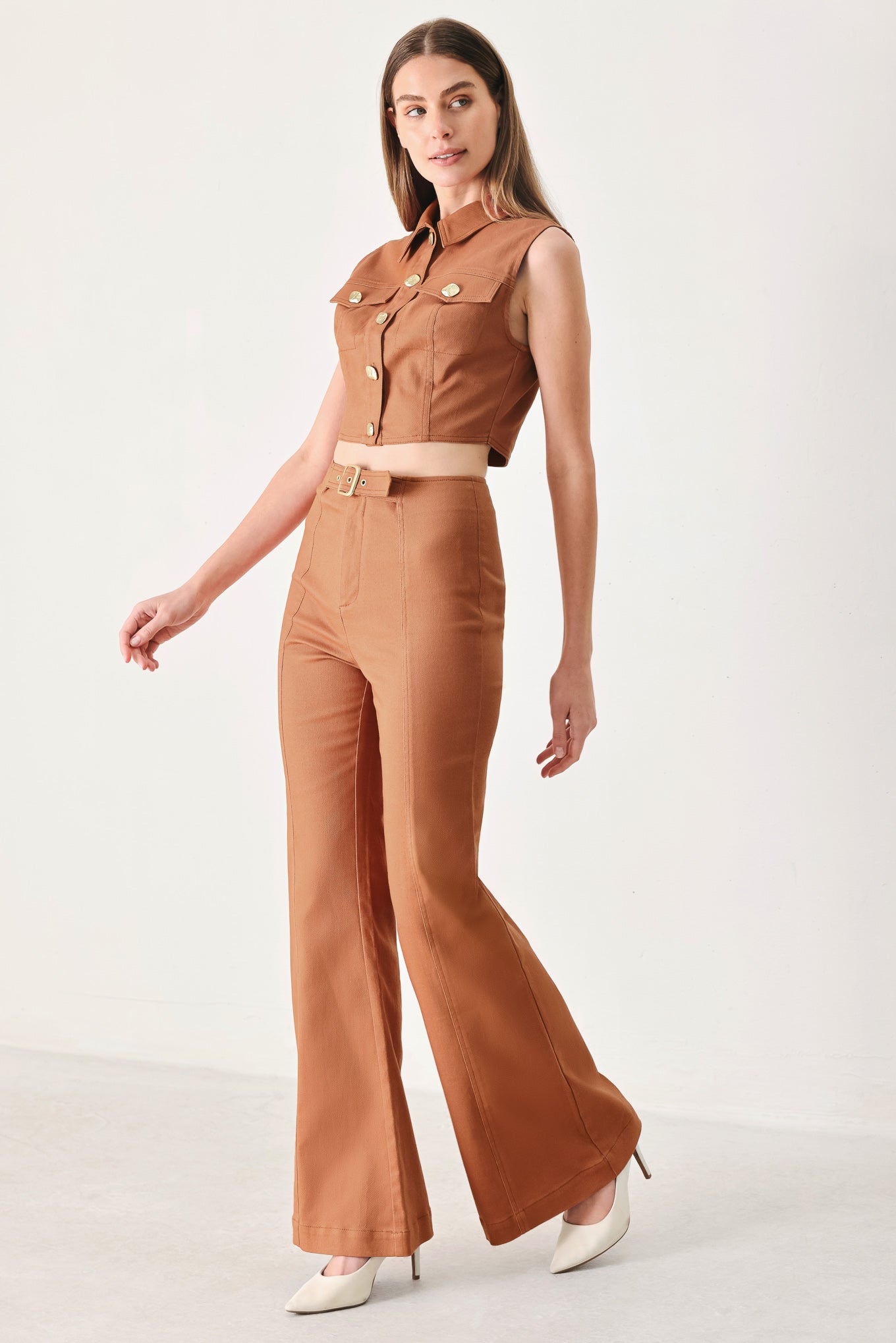 Woman wearing terracotta flared pants with belt tab, front zipper and flare leg | FREEMARKET | Flying Tomato
