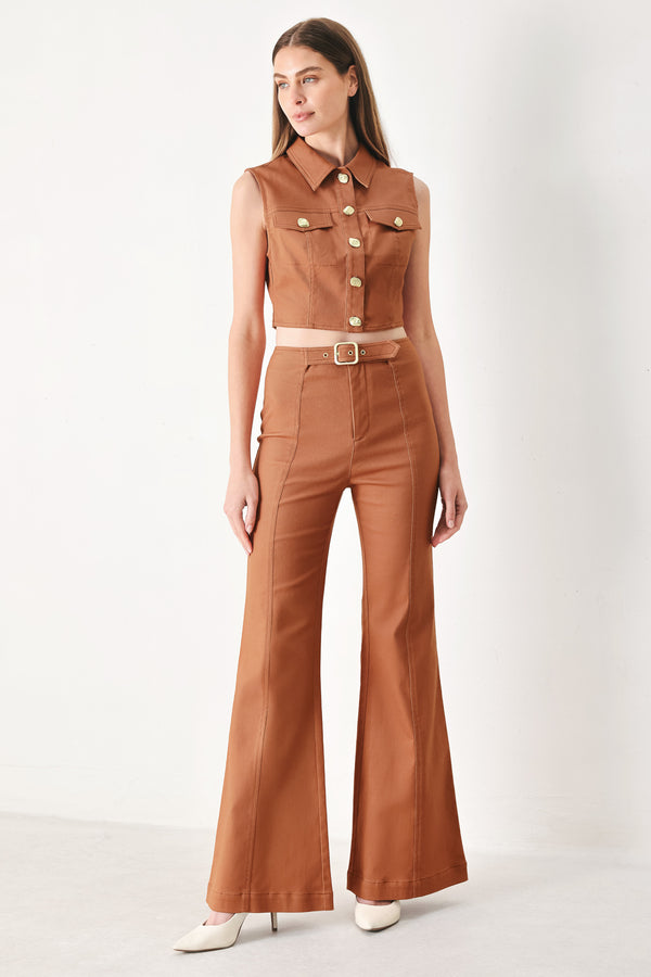 Woman wearing terracotta flared pants with belt tab, front zipper and flare leg | FREEMARKET | Flying Tomato