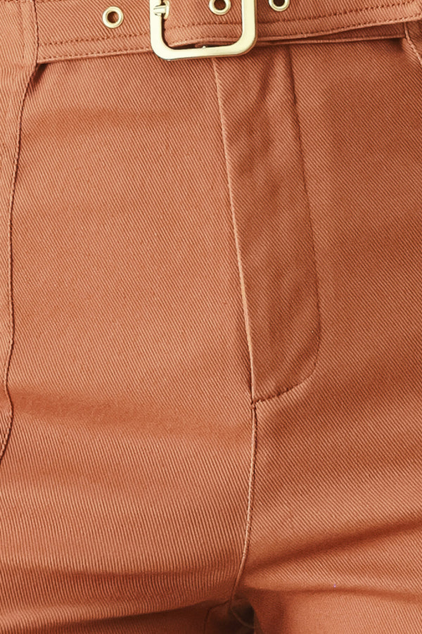 Close-up of terracotta pants with a metal buckle | FREEMARKET | Flying Tomato