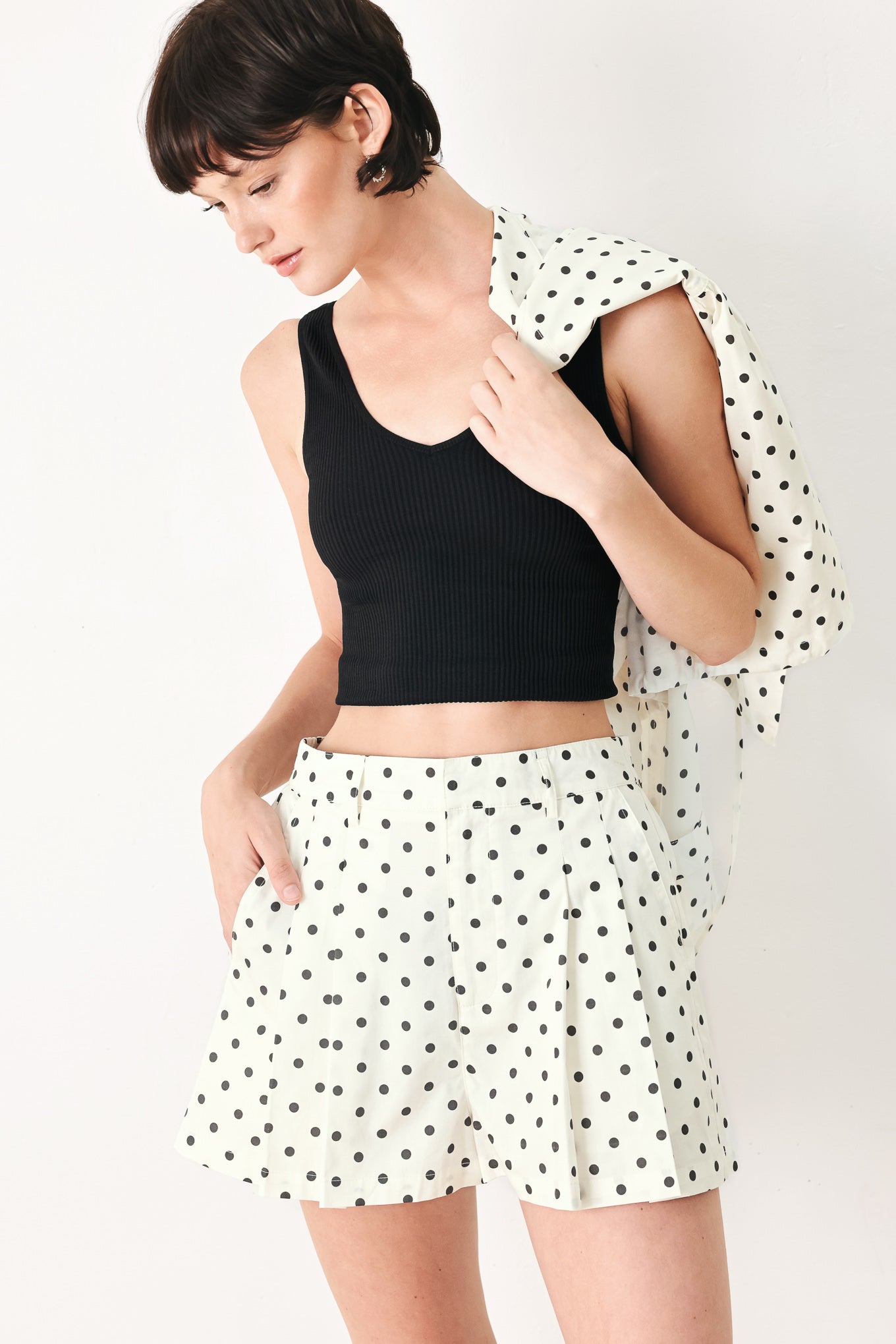Woman wearing  polka dot shorts with front closure and side pockets | FREEMARKET