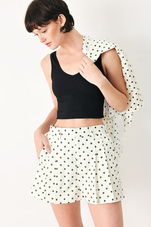 Woman wearing  polka dot shorts with front closure and side pockets | FREEMARKET