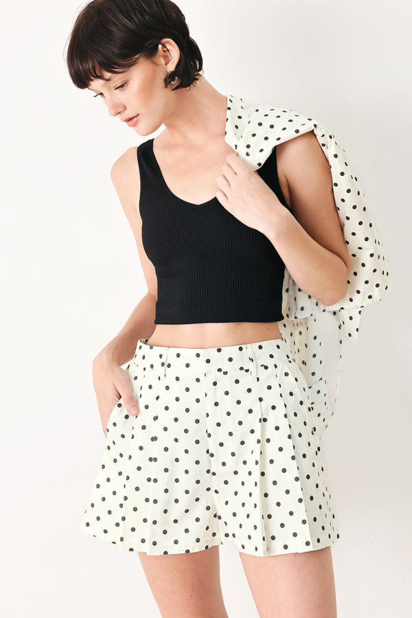 Woman wearing  polka dot shorts with front closure and side pockets | FREEMARKET