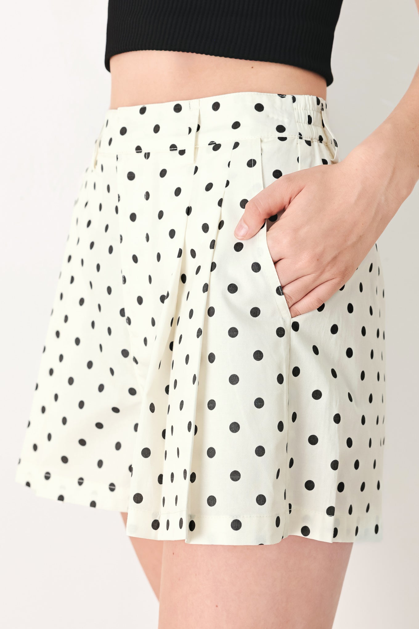 Woman wearing  polka dot shorts with front closure and side pockets | FREEMARKET
