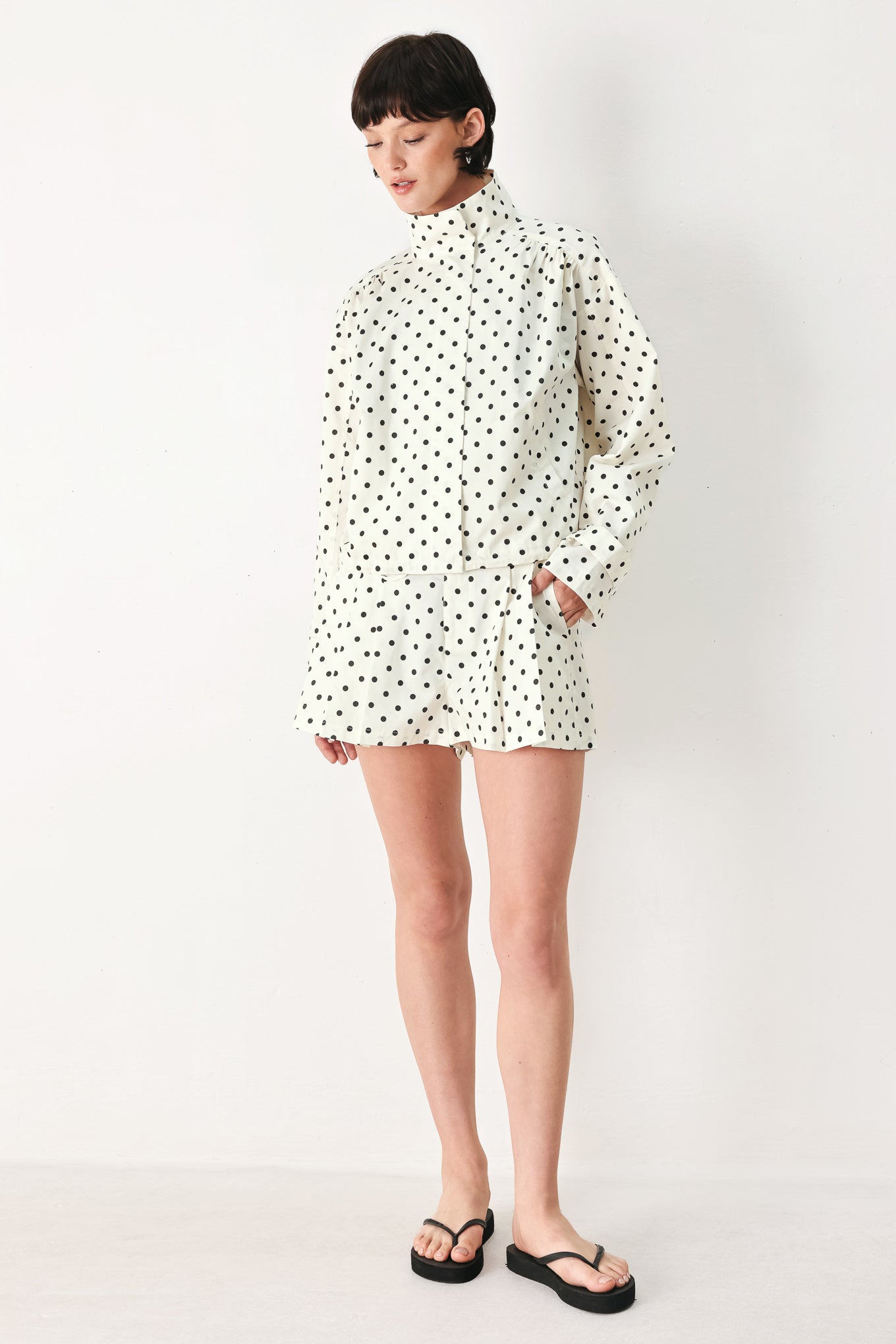 Woman wearing  polka dot shorts with front closure and side pockets | FREEMARKET