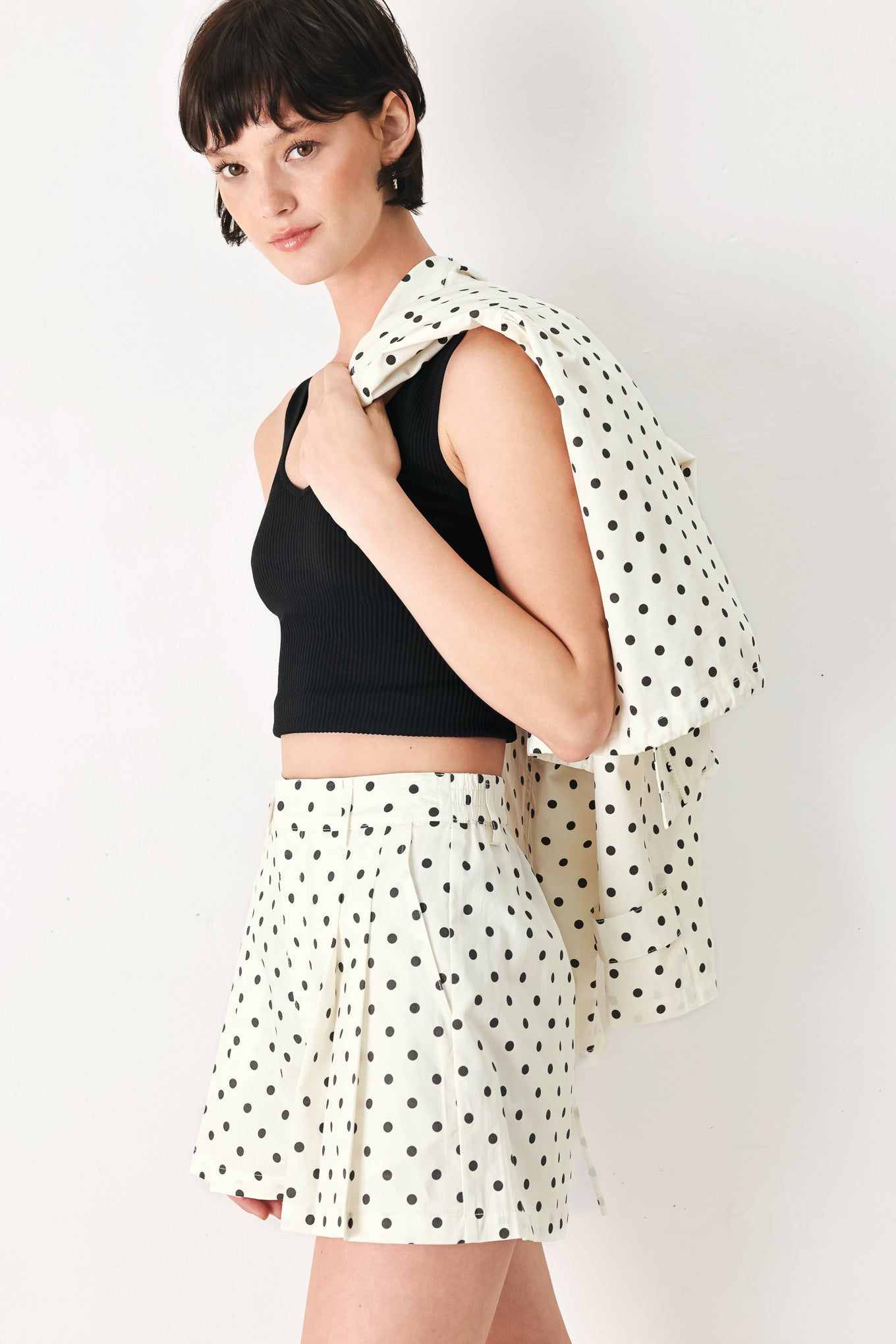 Woman wearing  polka dot shorts with front closure and side pockets | FREEMARKET