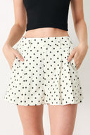 Woman wearing  polka dot shorts with front closure and side pockets | FREEMARKET