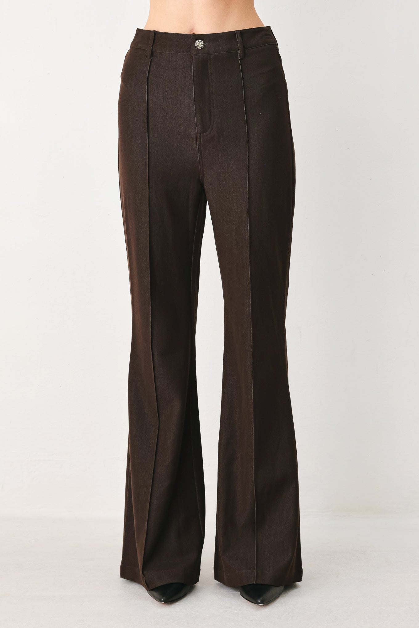 Woman wearing brown flared pants | FREEMARKET