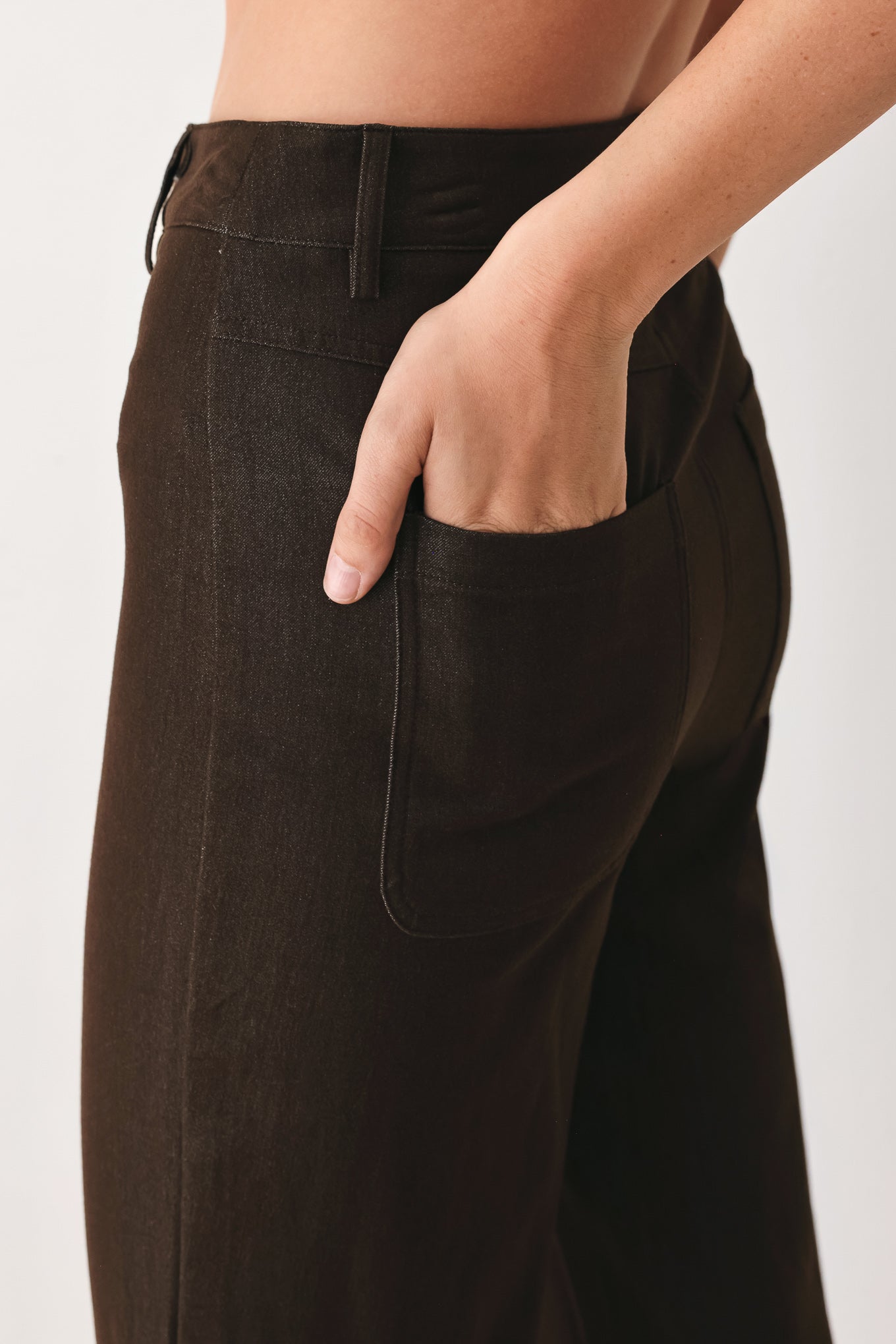 Woman wearing brown flared pants | FREEMARKET