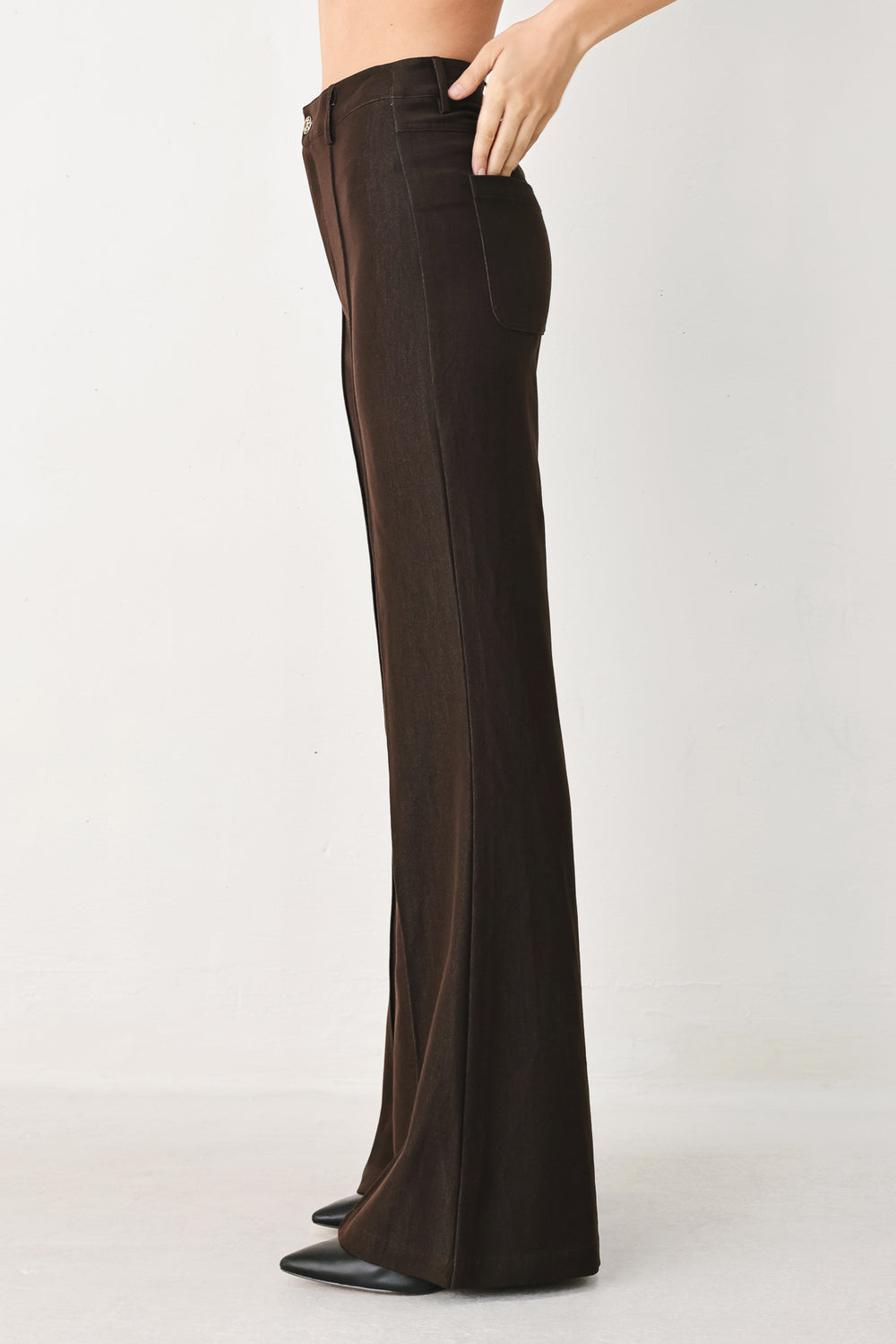 Woman wearing brown flared pants | FREEMARKET