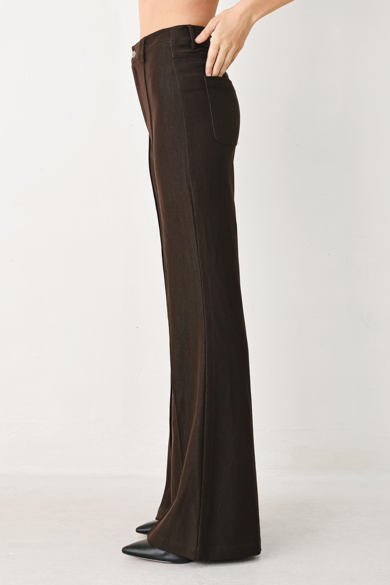Woman wearing brown flared pants | FREEMARKET
