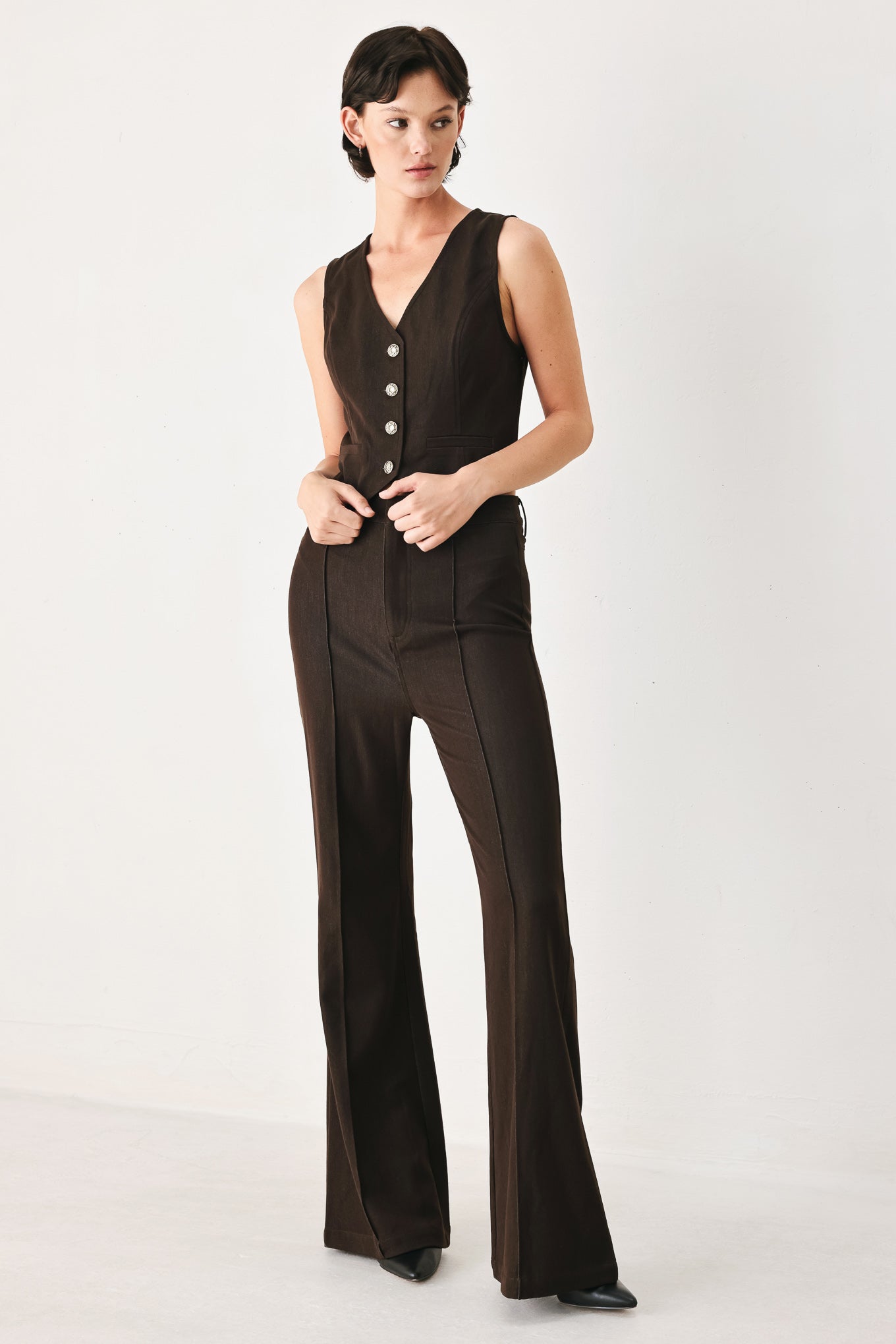 Woman wearing brown flared pants | FREEMARKET