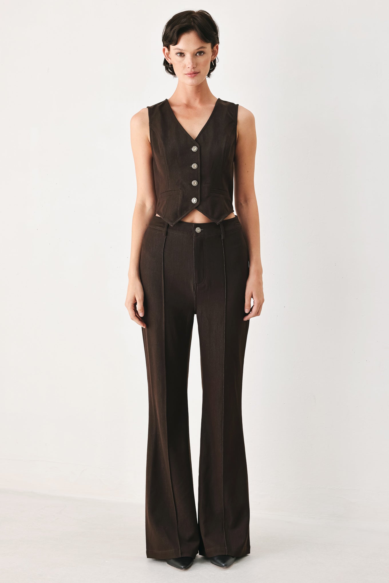 Woman wearing brown flared pants | FREEMARKET