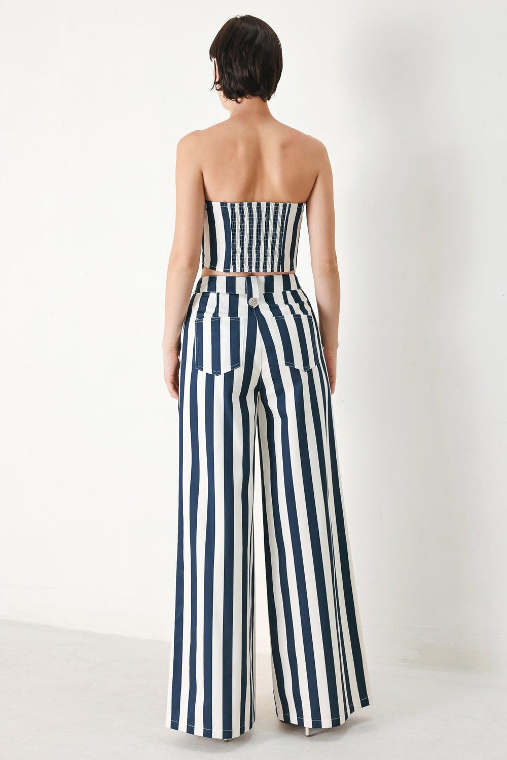 NAVY BLOSSOM WOVEN PANTS.