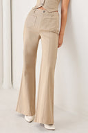 Woman wearing taupe beige flared pants with front pockets | FREEMARKET