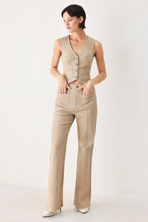 Woman wearing taupe beige flared pants with front pockets | FREEMARKET