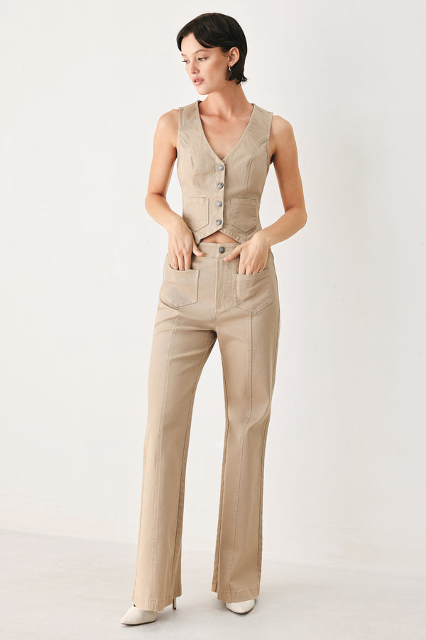 Woman wearing taupe beige flared pants with front pockets | FREEMARKET