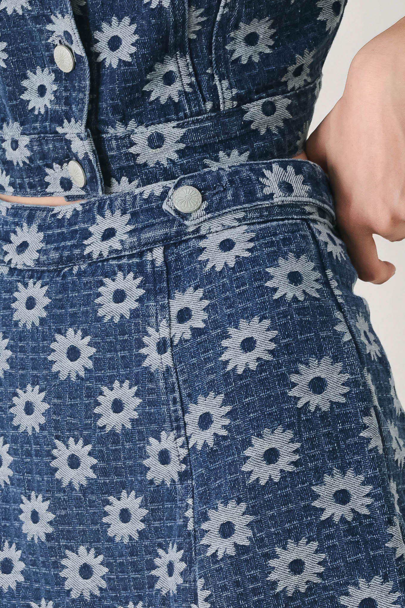 Woman wearing a jacquard blue denim skort with side tab front side slit and back zipper closure | FREEMARKET