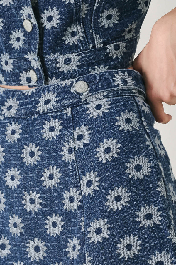 Woman wearing a jacquard blue denim skort with side tab front side slit and back zipper closure | FREEMARKET