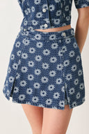 Woman wearing a jacquard blue denim skort with side tab front side slit and back zipper closure | FREEMARKET
