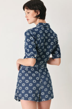 Woman wearing a jacquard blue denim skort with side tab front side slit and back zipper closure | FREEMARKET