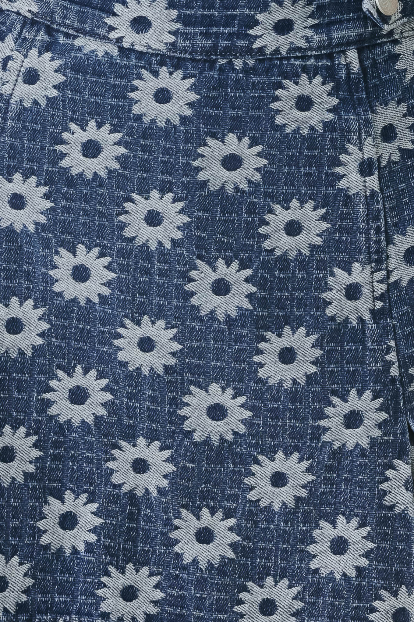 Woman wearing a jacquard blue denim skort with side tab front side slit and back zipper closure | FREEMARKET