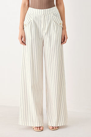 Woman wearing off white pants with thin navy stripes and front pockets | FREEMARKET