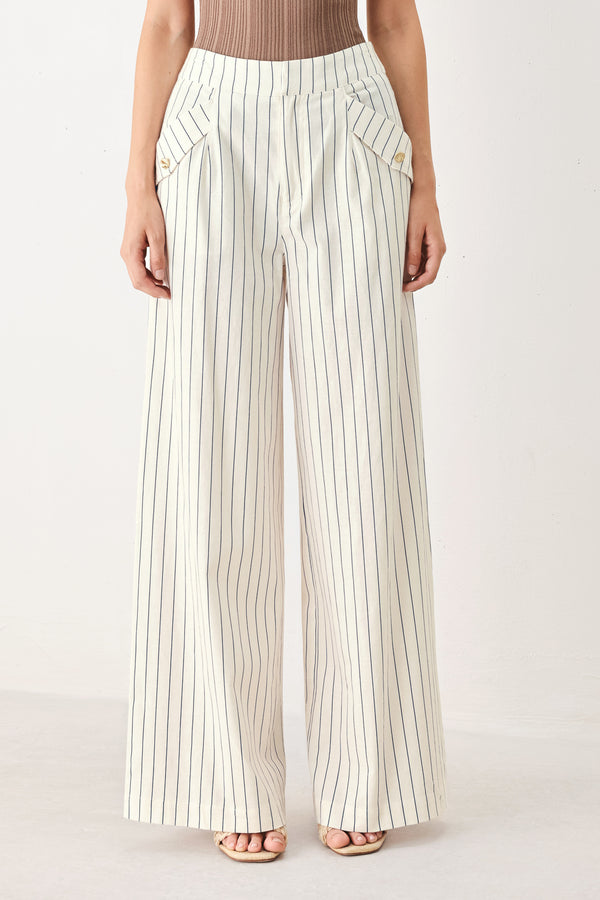 Woman wearing off white pants with thin navy stripes and front pockets | FREEMARKET