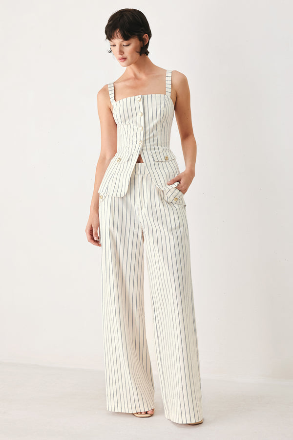 Woman wearing off white pants with thin navy stripes and front pockets | FREEMARKET