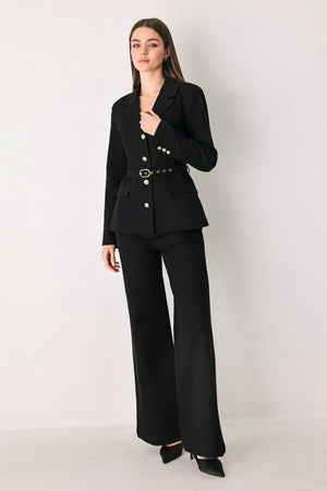 Woman wearing a pair of high waisted black denim flared jeans | FREEMARKET