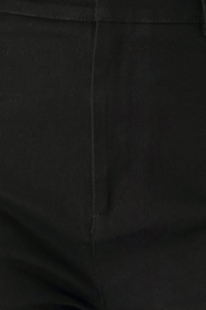 Woman wearing a pair of high waisted black denim flared jeans | FREEMARKET