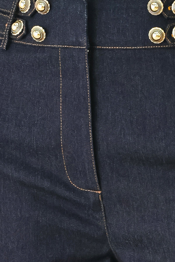 Woman wearing dark denim navy blue wide-leg pants with gold buttons | FREEMARKET