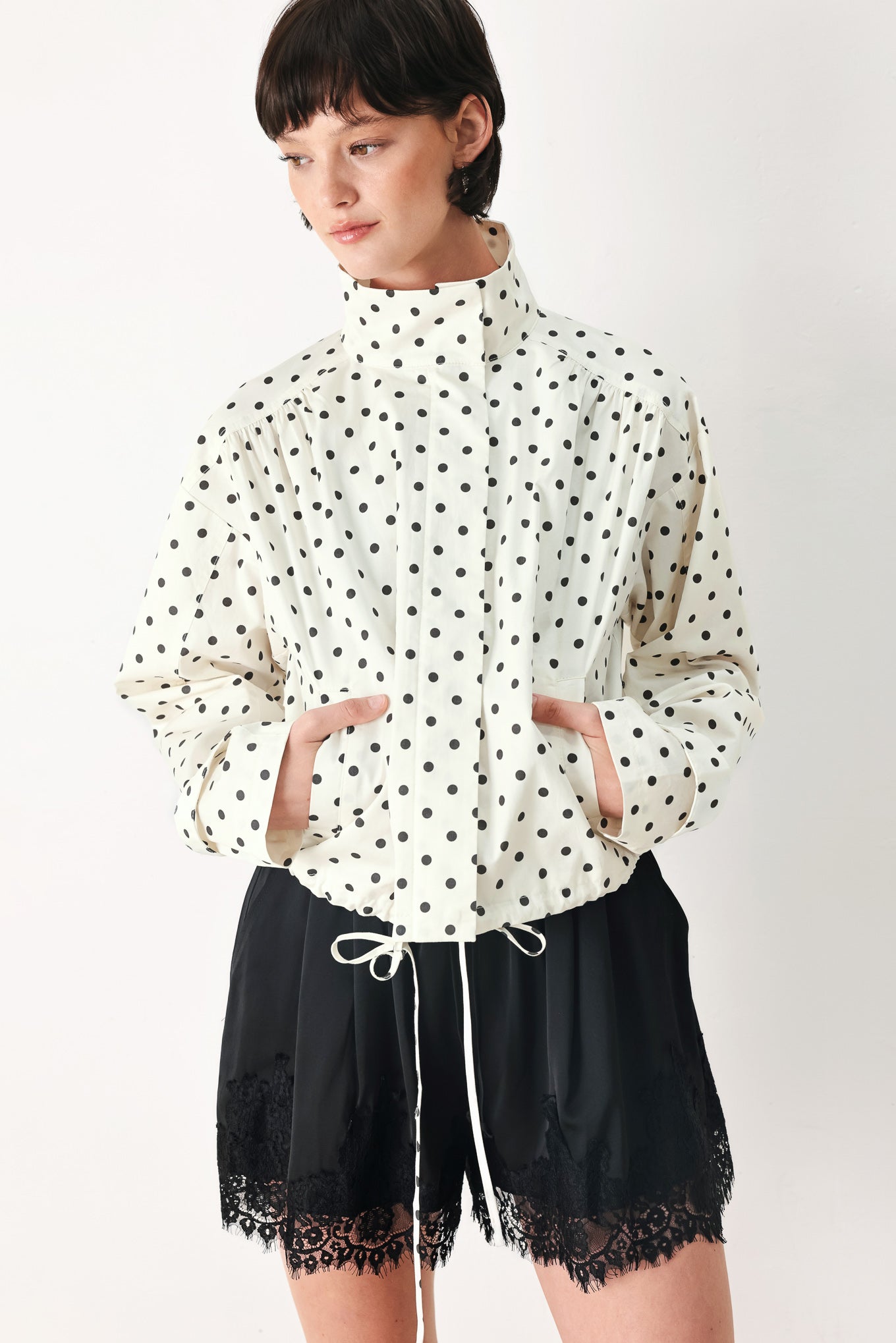 Woman wearing black shorts with lace trim and elastic waistband | FREEMARKET