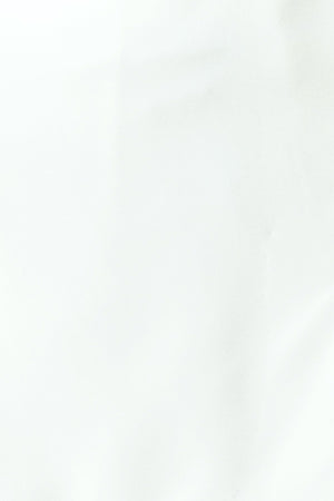 Woman wearing a white skort with side zipper closure | FREEMARKET