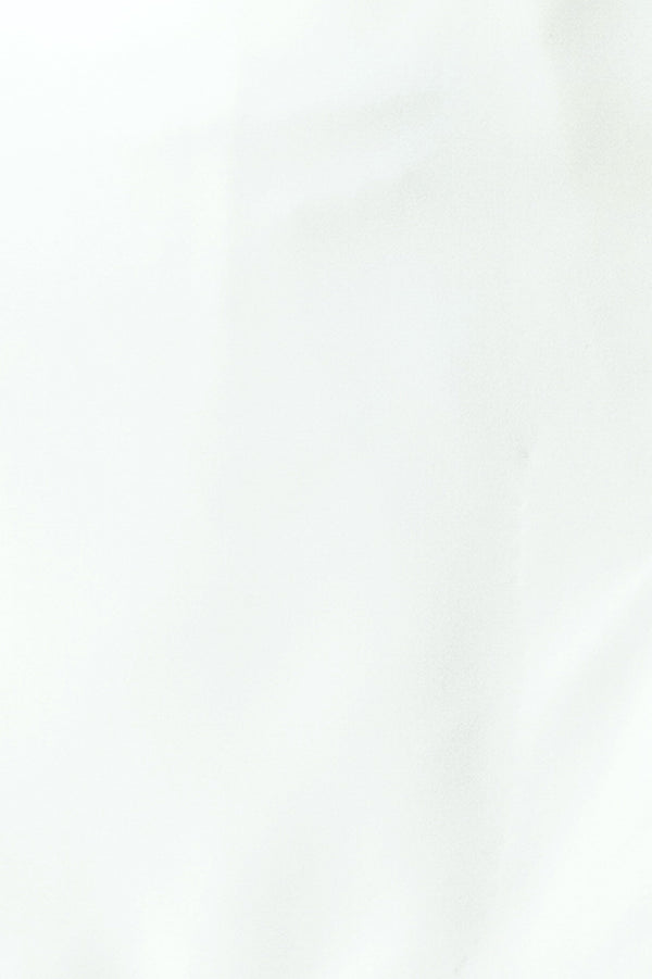 Woman wearing a white skort with side zipper closure | FREEMARKET