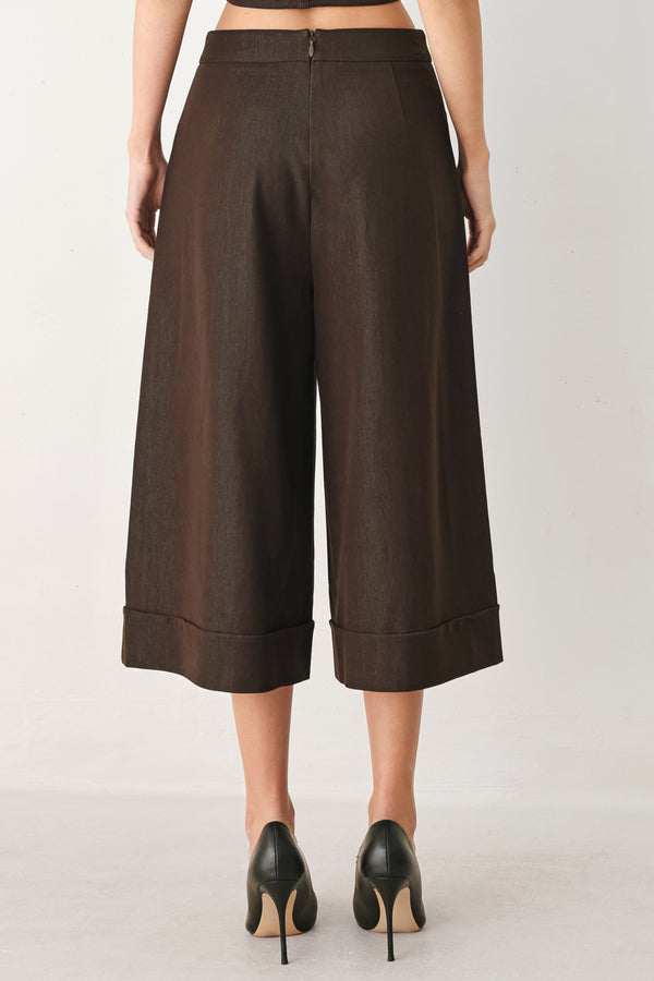 Woman wearing brown solid woven culotte pant with front button detail and back zipper closure | FREEMARKET