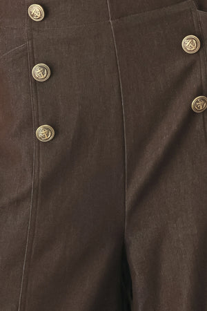 Woman wearing brown solid woven culotte pant with front button detail and back zipper closure | FREEMARKET