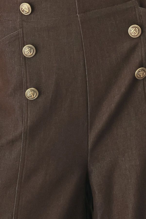 Woman wearing brown solid woven culotte pant with front button detail and back zipper closure | FREEMARKET