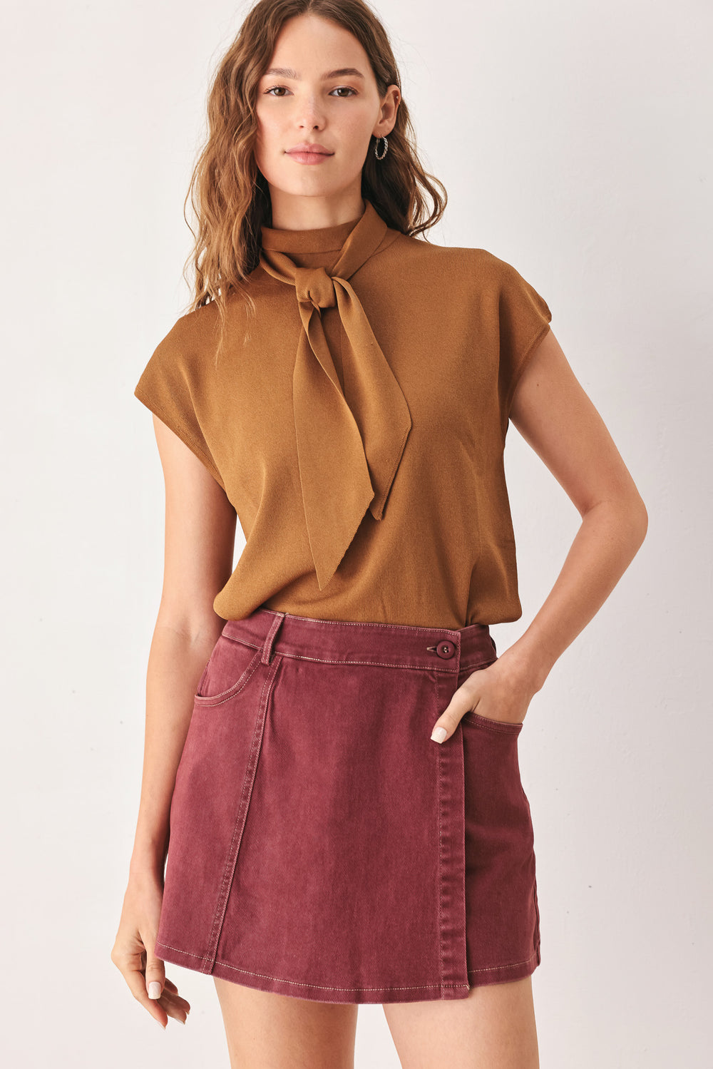 A woman wearing a wine colored mini skort | FREEMARKET