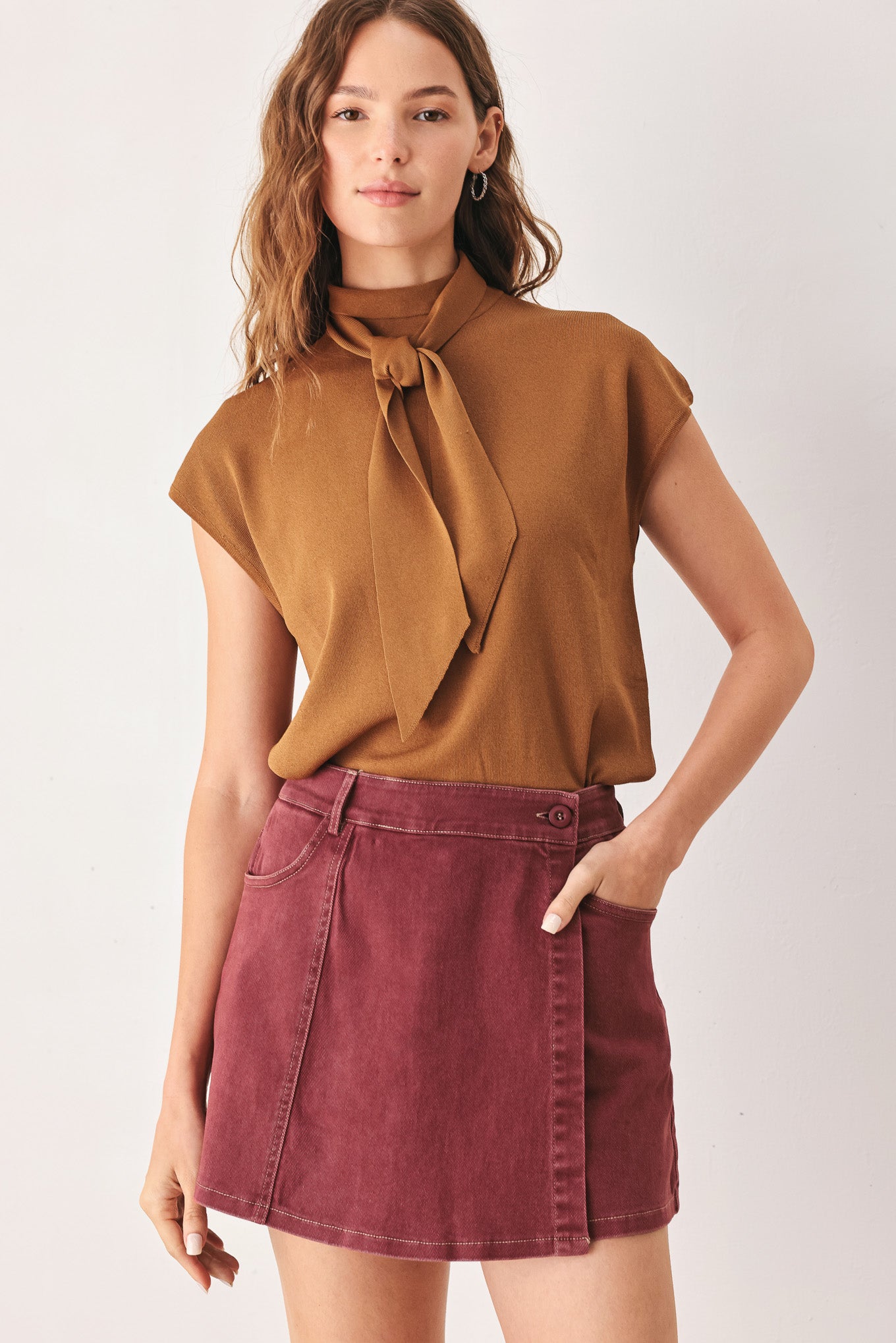 A woman wearing a wine colored mini skort | FREEMARKET