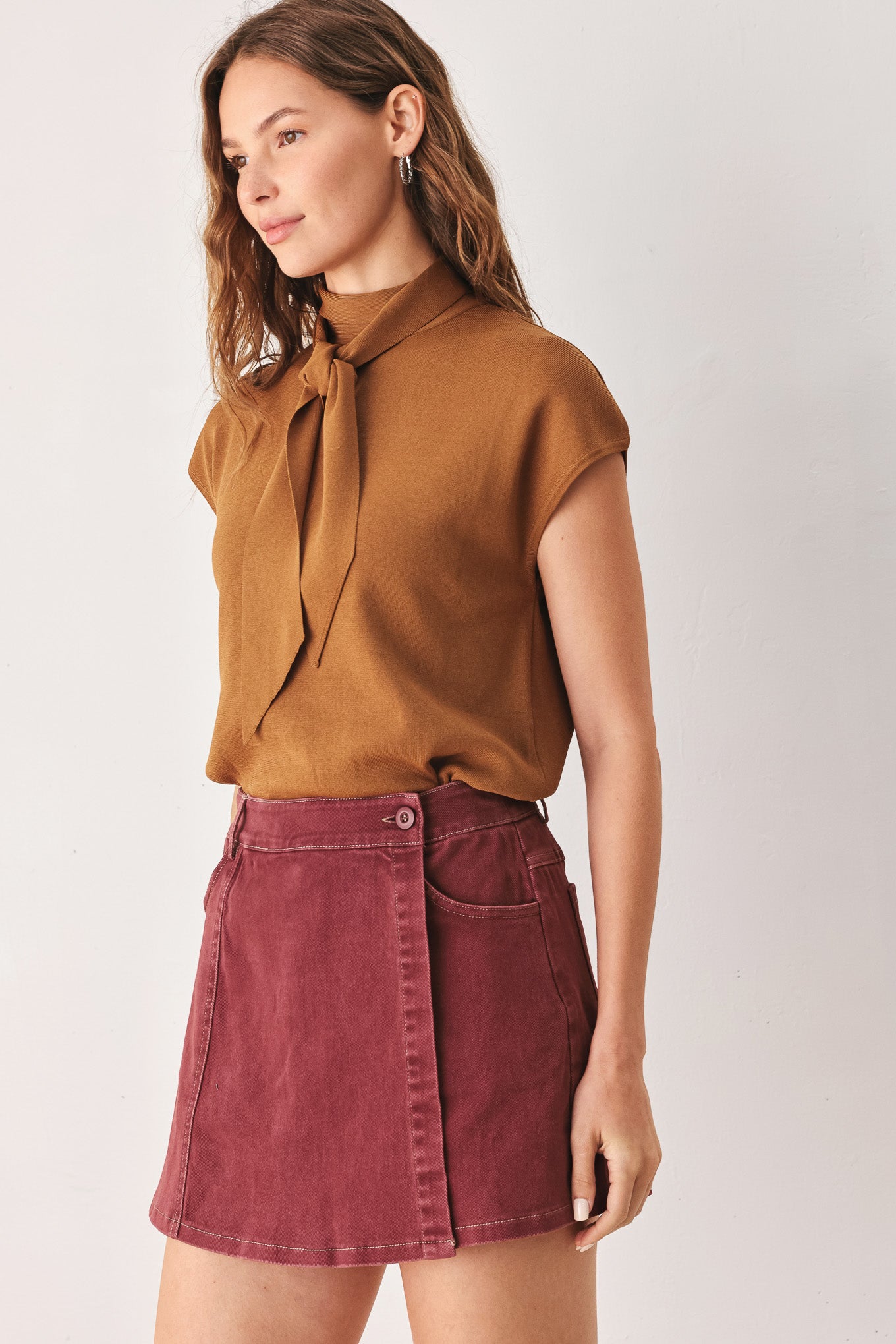 A woman wearing a wine colored mini skort | FREEMARKET