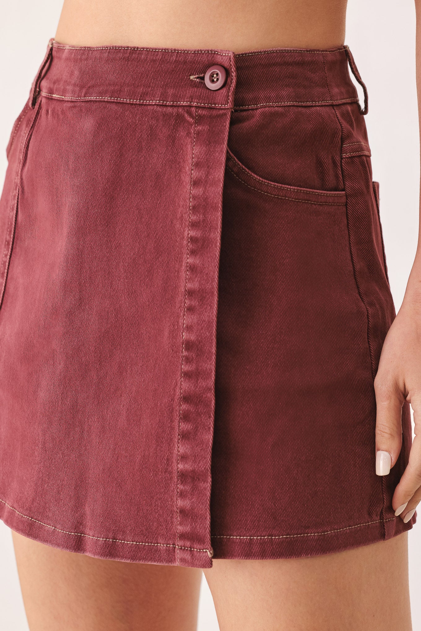 A woman wearing a wine colored mini skort | FREEMARKET