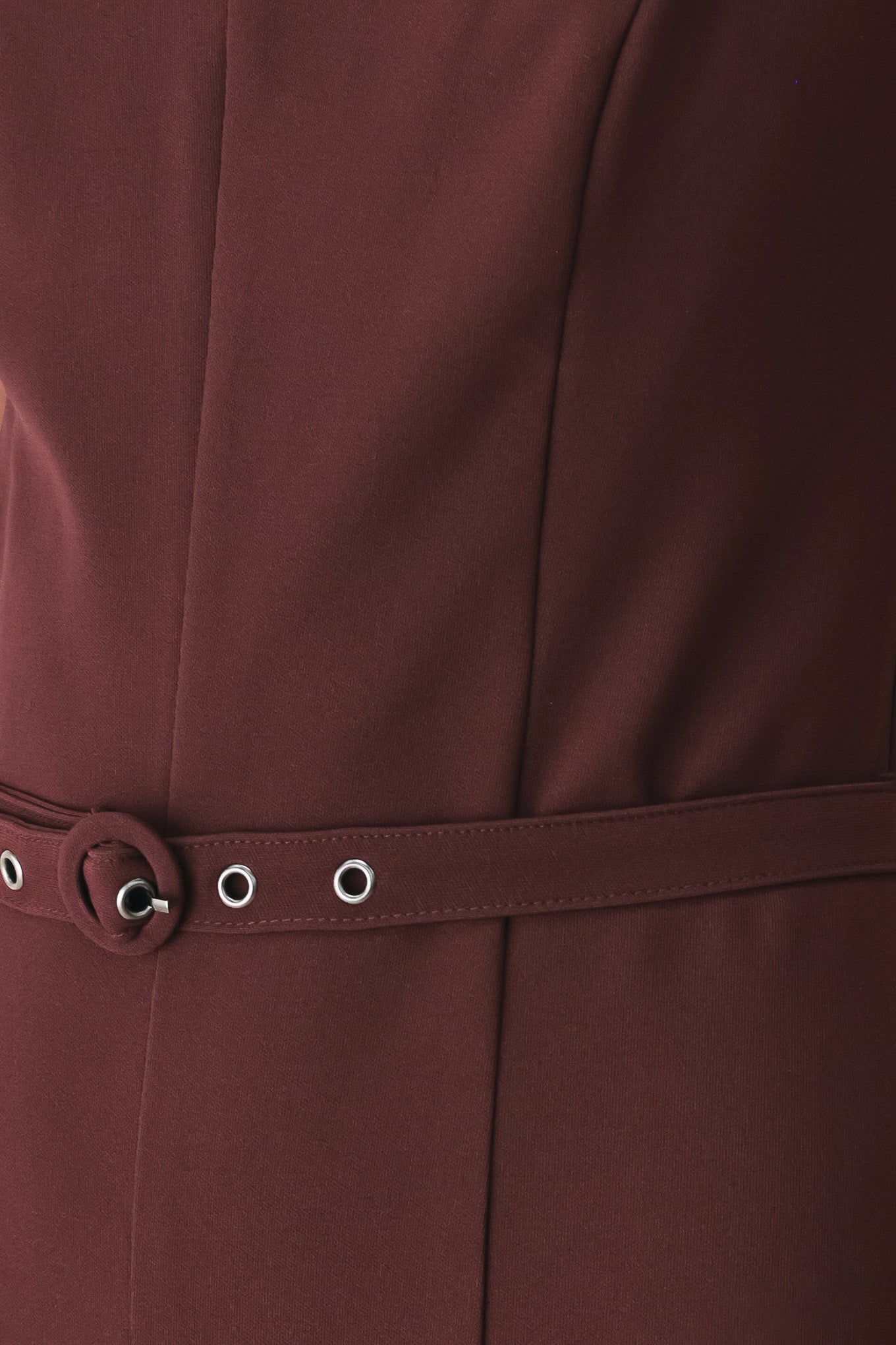 A woman modeling a dark burgundy wide-leg jumpsuit with thin spaghetti straps and a matching waist belt | FREEMARKET