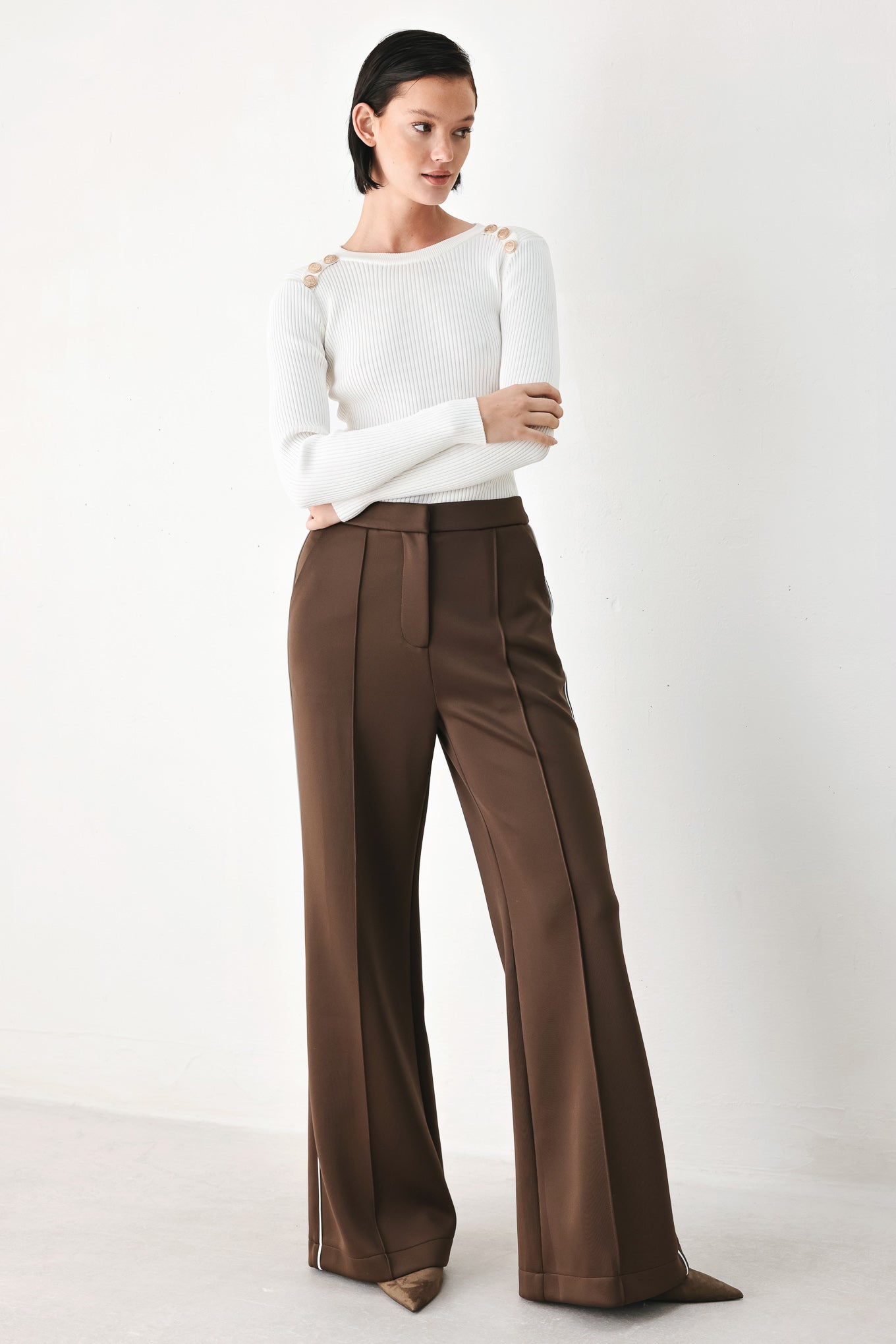 Model wearing brown wide-leg trousers with white side stripes | FREEMARKET
