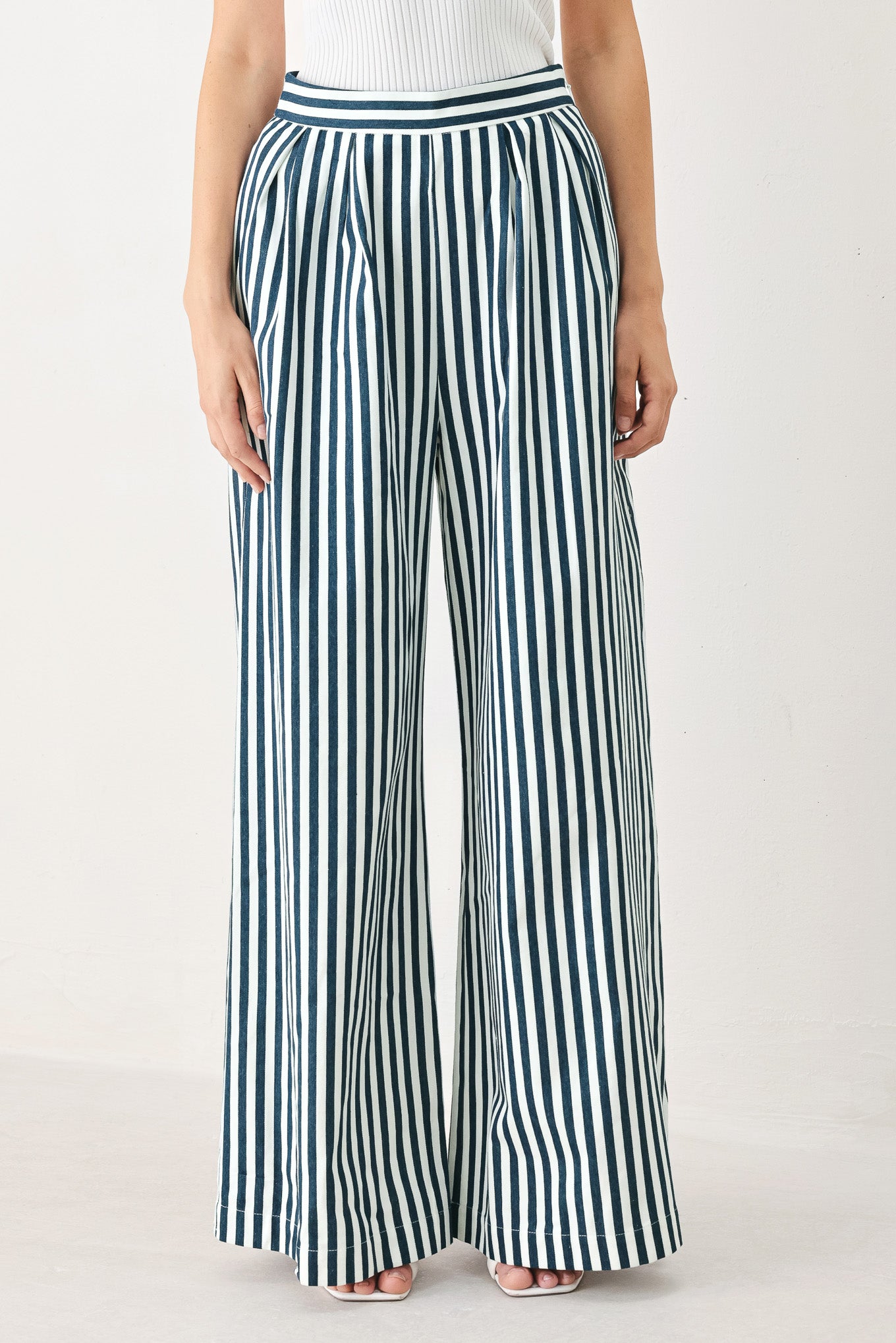 Woman wearing blue and white striped wide-leg pants | FREEMARKET