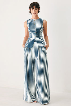 Woman wearing blue and white striped wide-leg pants | FREEMARKET