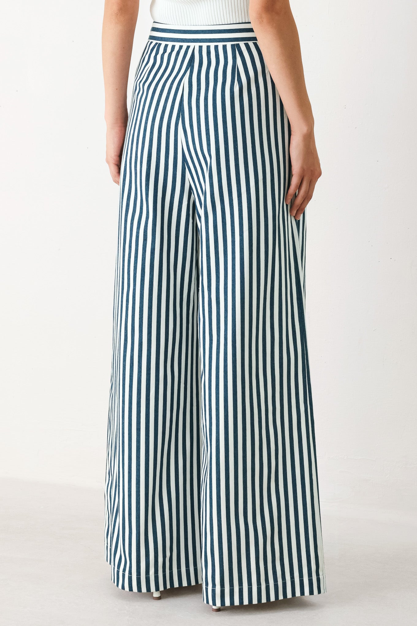 Woman wearing blue and white striped wide-leg pants | FREEMARKET