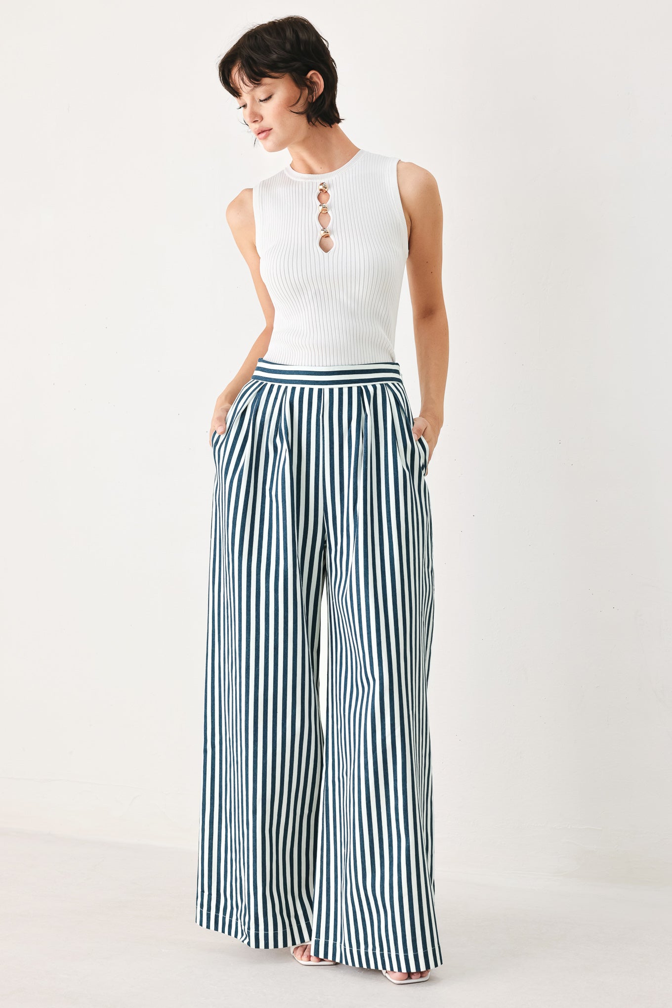 Woman wearing blue and white striped wide-leg pants | FREEMARKET