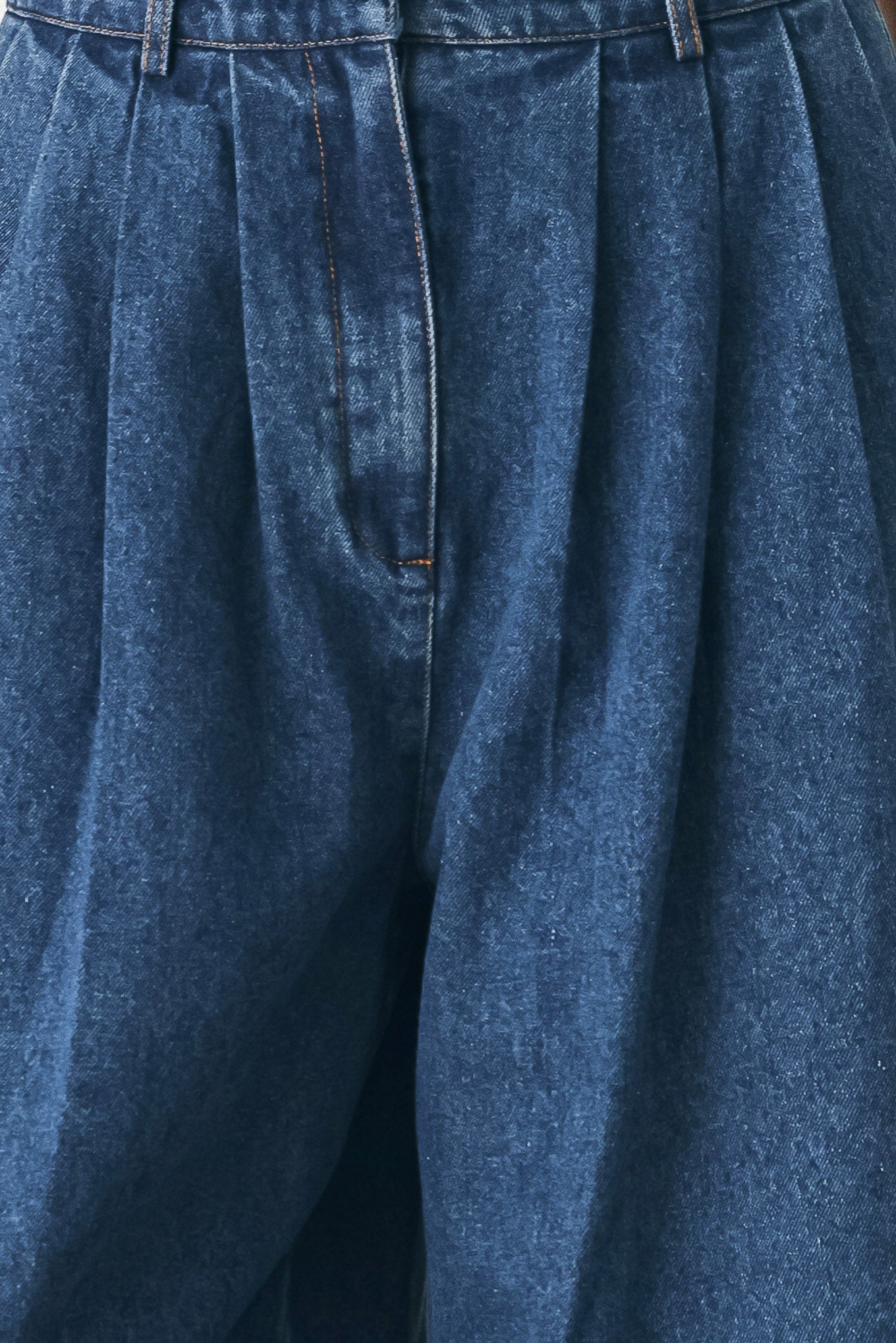 A woman wearing high-waisted, wide-leg blue denim pants with a wide-leg fit | FREEMARKET
